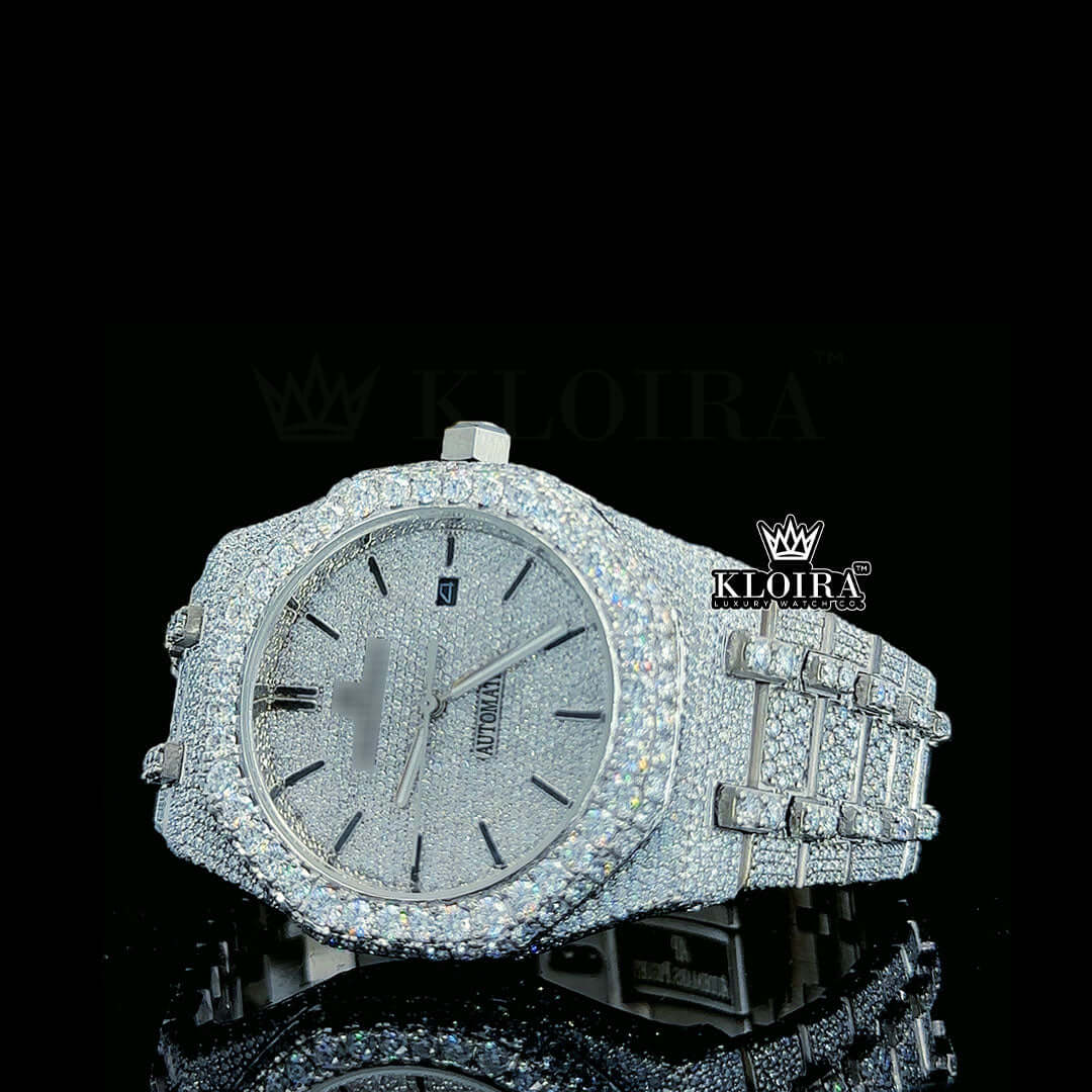 Iced out diamond watch with silver finish, black markers, and gleaming accents, showcasing luxury and elegance.
