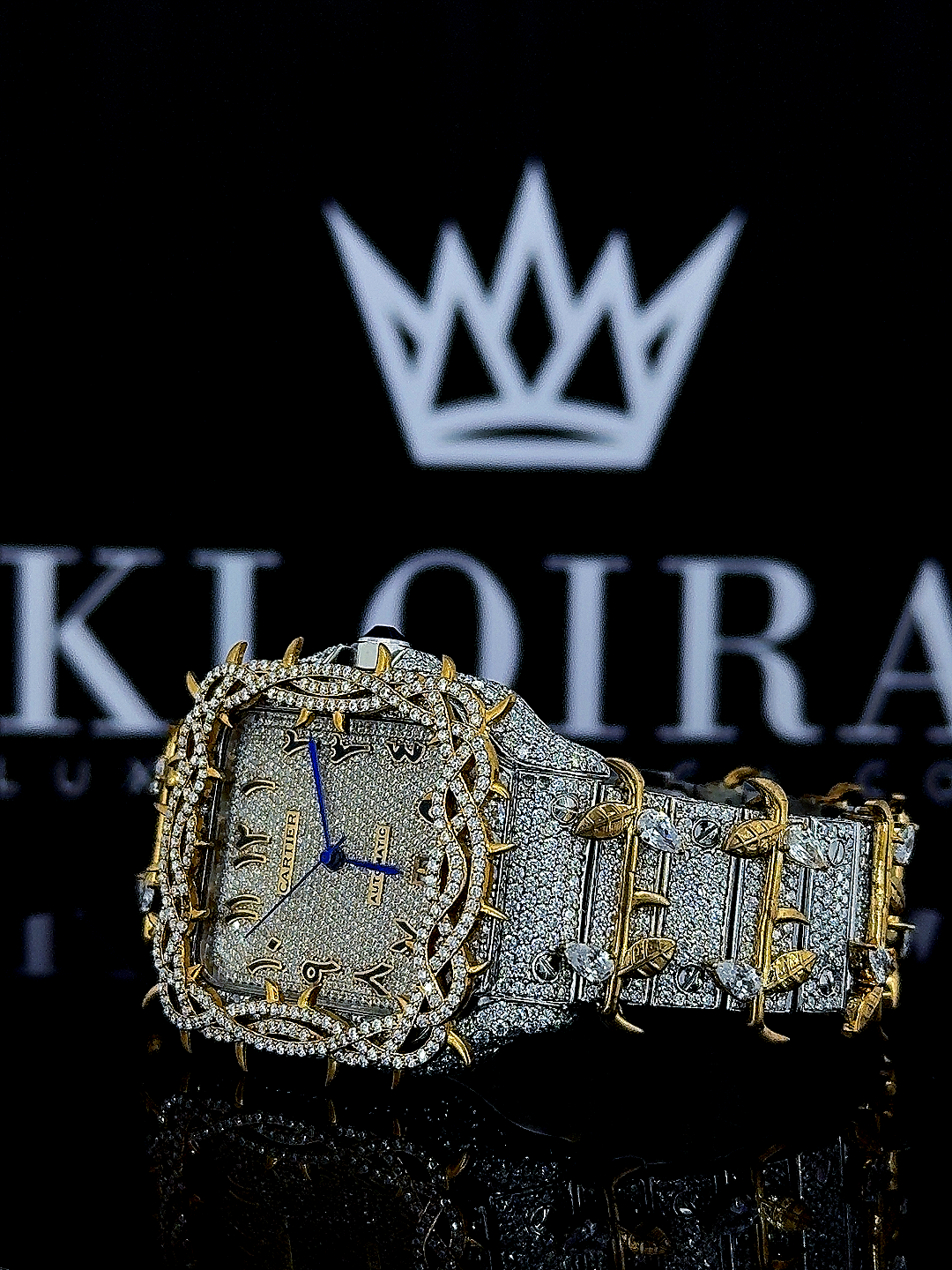 Cartier Santos Jesus Thorn yellow gold moissanite watch with diamond-encrusted face and bold design.