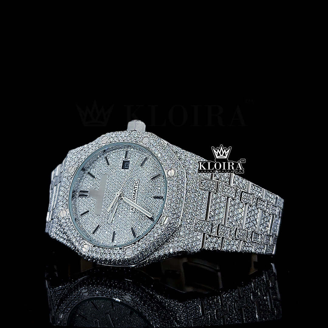 Fully iced out AP Moissanite diamond watch with black numerals, luxurious silver dial, and gold-plated frame.