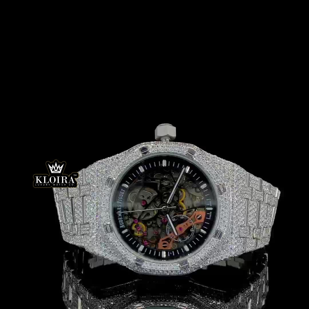 Front view of Moissanite AP skeleton watch with fully iced case and strap, showcasing open-worked dial and visible movement components