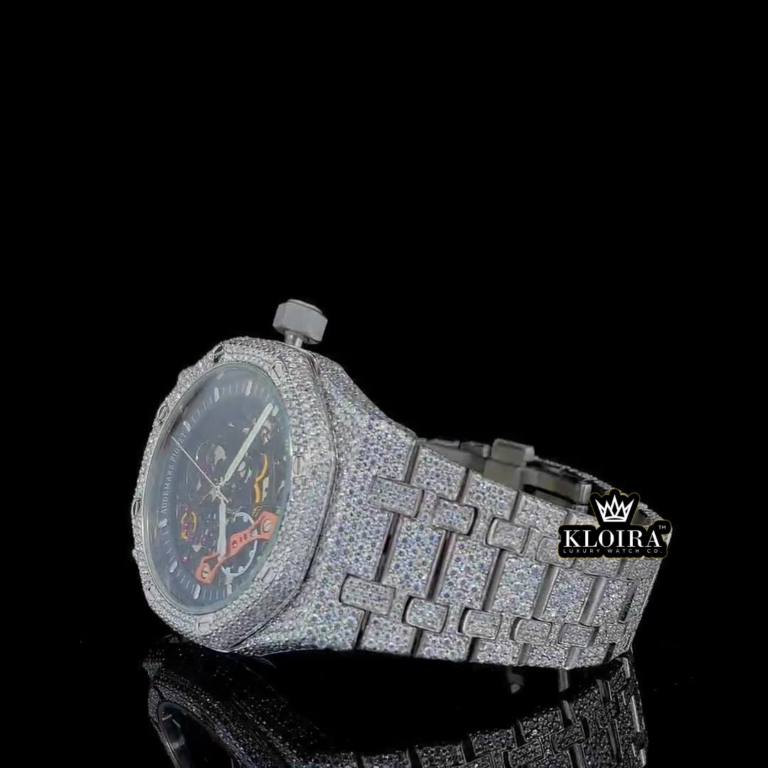 Front view of Moissanite AP skeleton watch with fully iced case and strap, showcasing open-worked dial and visible movement components