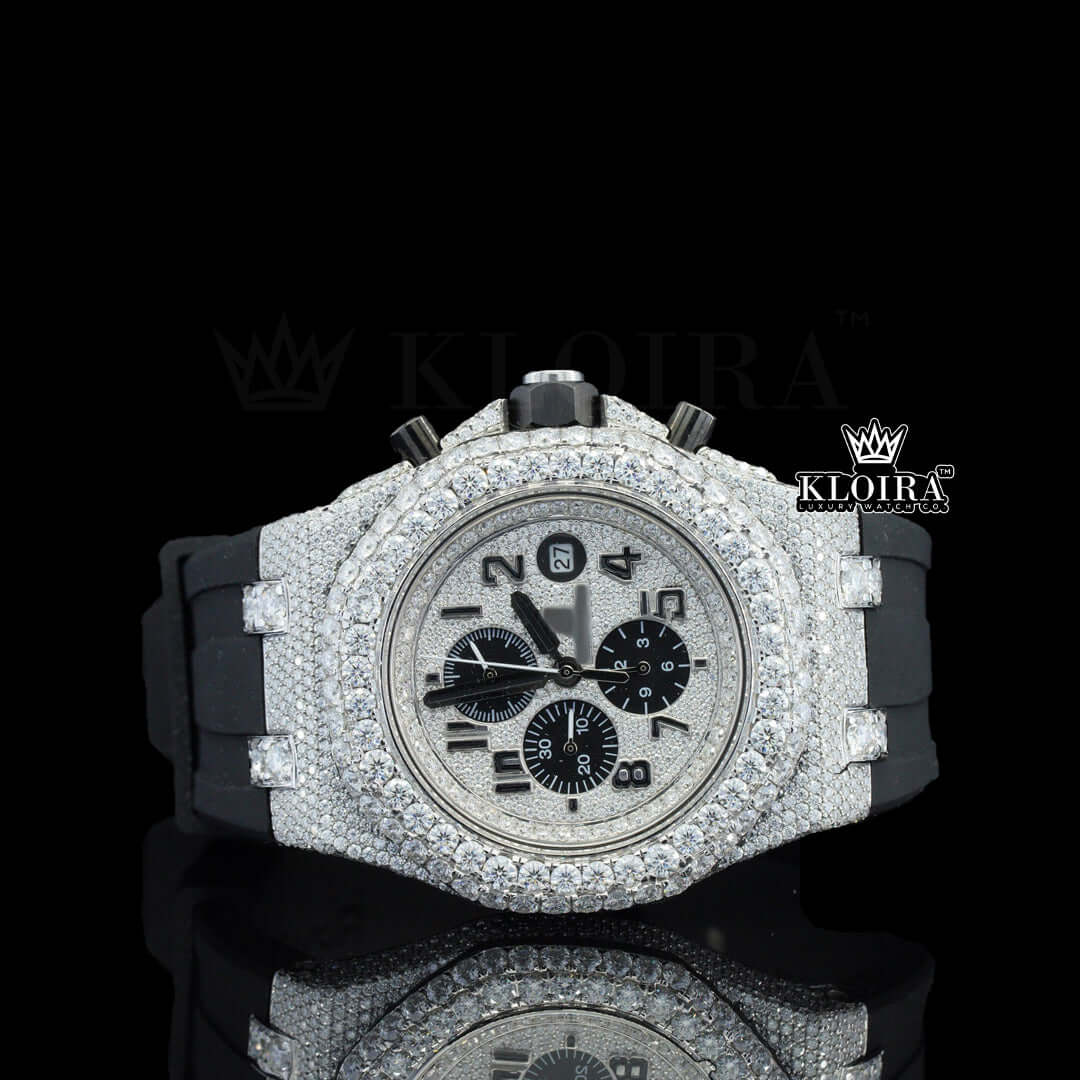 Fully iced out silver dial watch with moissanite diamonds on a black rubber strap, featuring bold black hands and chronograph dials.