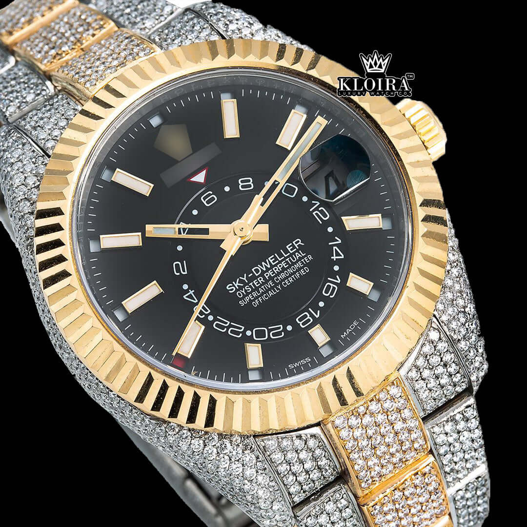 Two Tone Sky-Dweller iced out watch with black dial and 14K gold-plated case, featuring VVS moissanite diamonds.
