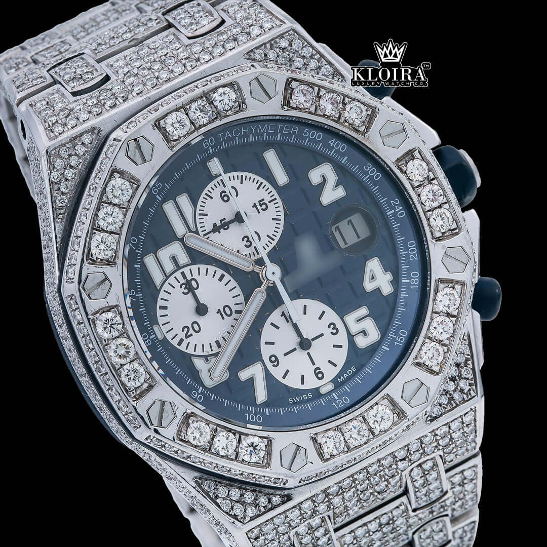 Audemars Piguet blue dial iced out Moissanite diamond watch with chronograph features in a luxurious design.