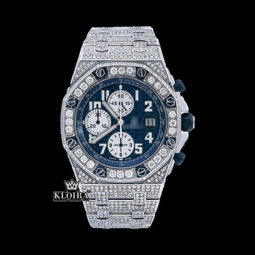 Audemars Piguet blue dial iced out Moissanite diamond watch with chronograph features in a luxurious design.