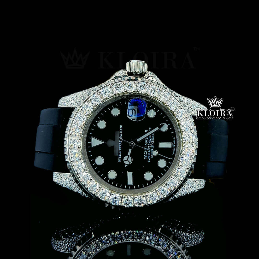 Rolex Yacht-Master iced out watch with diamond bezel, black dial, and rubber strap accentuating luxury.