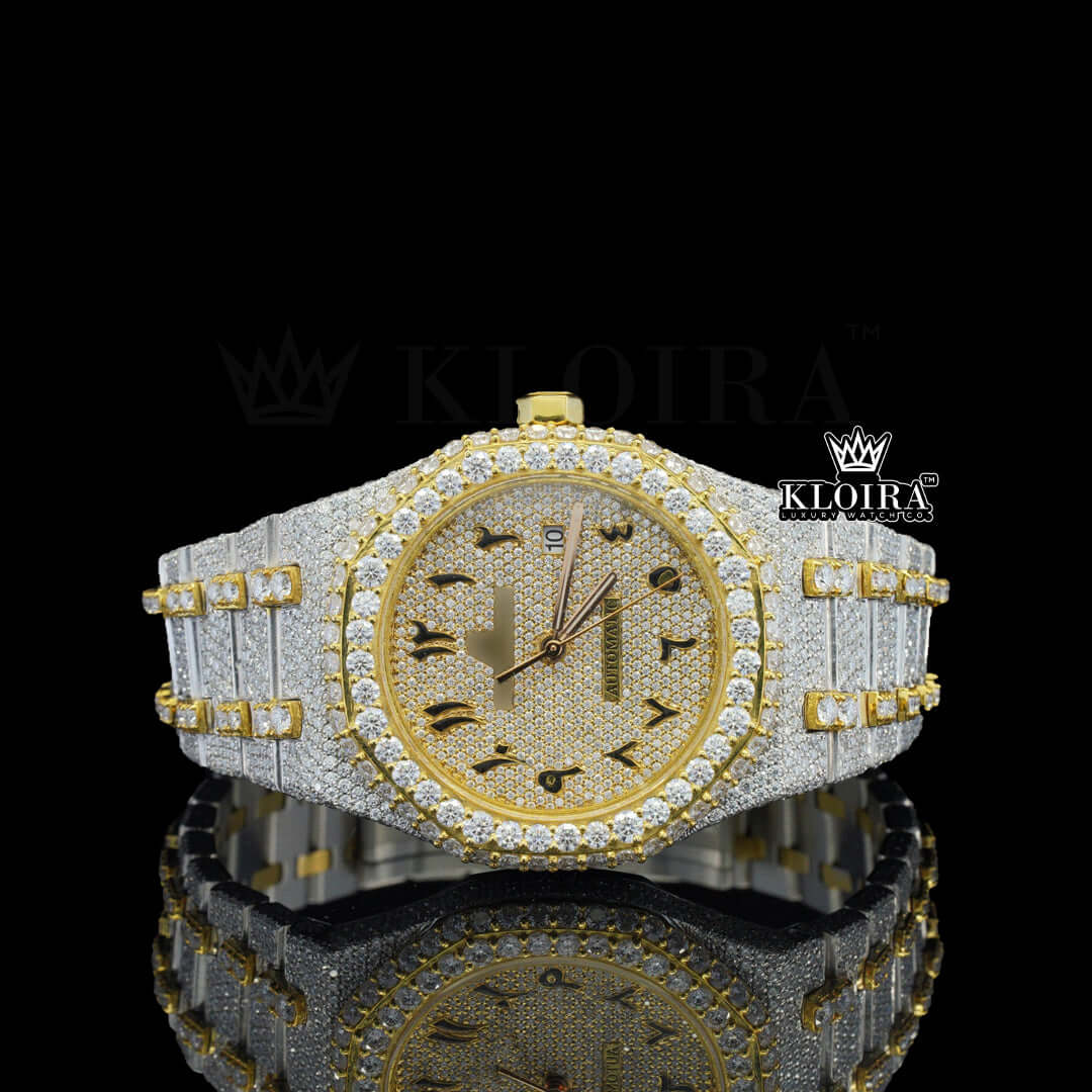 Yellow dial AP diamond watch with Arabic numerals, VVS clarity moissanite stones, and two-tone fully iced-out strap, front-facing view.