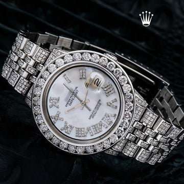 Angled view of Rolex Diamond Watch featuring mother of pearl dial, Roman numeral hour markers, and fully encrusted bezel and bracelet