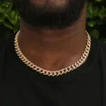 10mm Round Moissanite Cuban Link Chain Goldrush in 14K Yellow Gold Neck