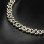 10mm Round Moissanite Cuban Link Chain Regalia in 14K Yellow Gold Closeup Middle Chain