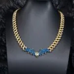12mm Round Moissanite Cuban Link Chain Batlink in 14K Yellow Gold Neck