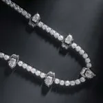5mm Round Moissanite Tennis Chain Gripstone in 14K White Gold Closeup Middle View