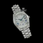 Blue Roman Numerals Dial Baguette Strap Iced Out Moissanite Watch Close Up Front View