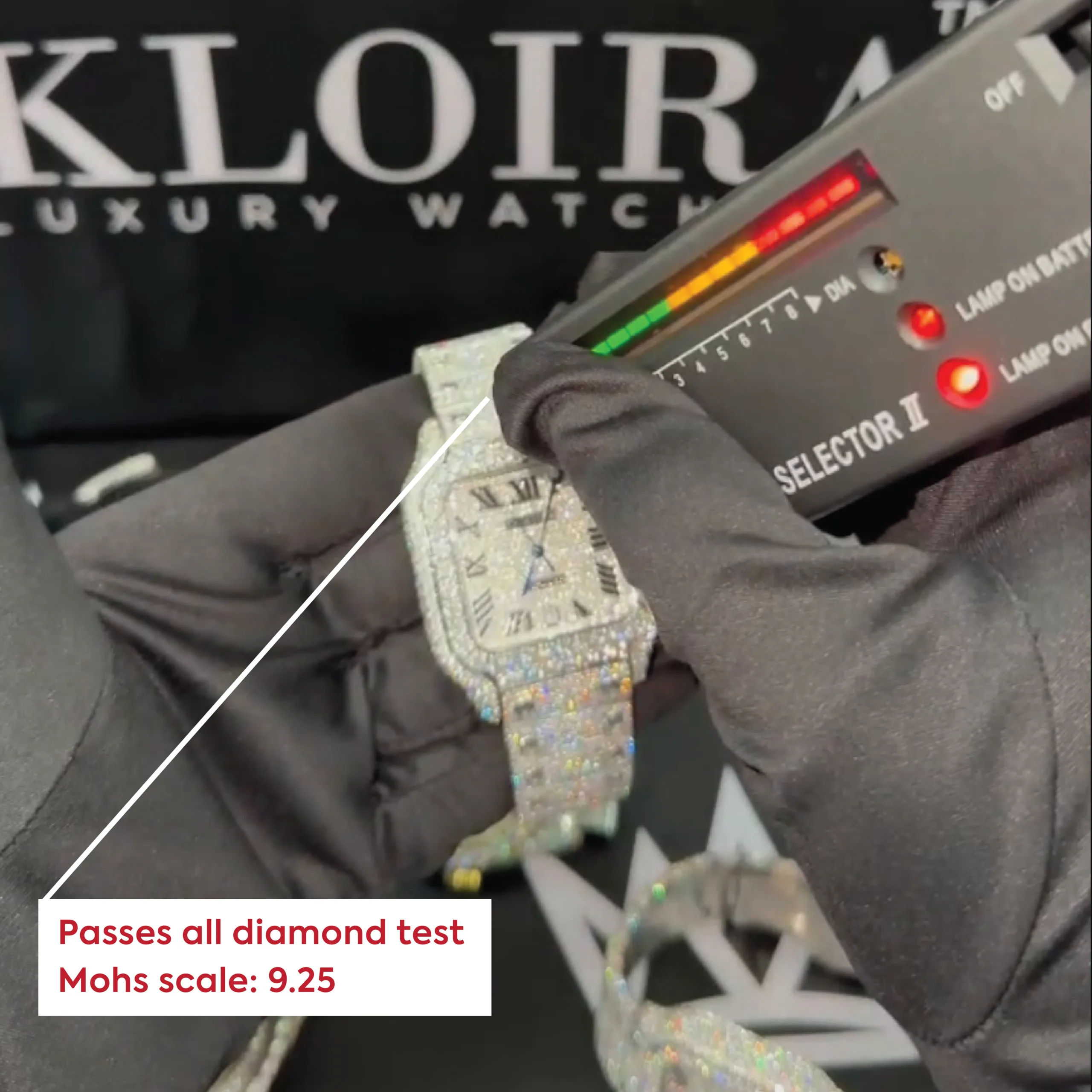 Hand testing a diamond watch with a selector, showing it passes the diamond test with a Mohs scale rating of 9.25.