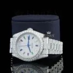 Day Date Display Rainbow Stick Markers Dial Full Iced Out Moissanite Watch Left Profile View