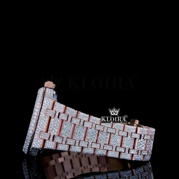 Rose gold fully iced out watch bracelet featuring moissanite gems on a glossy black background.