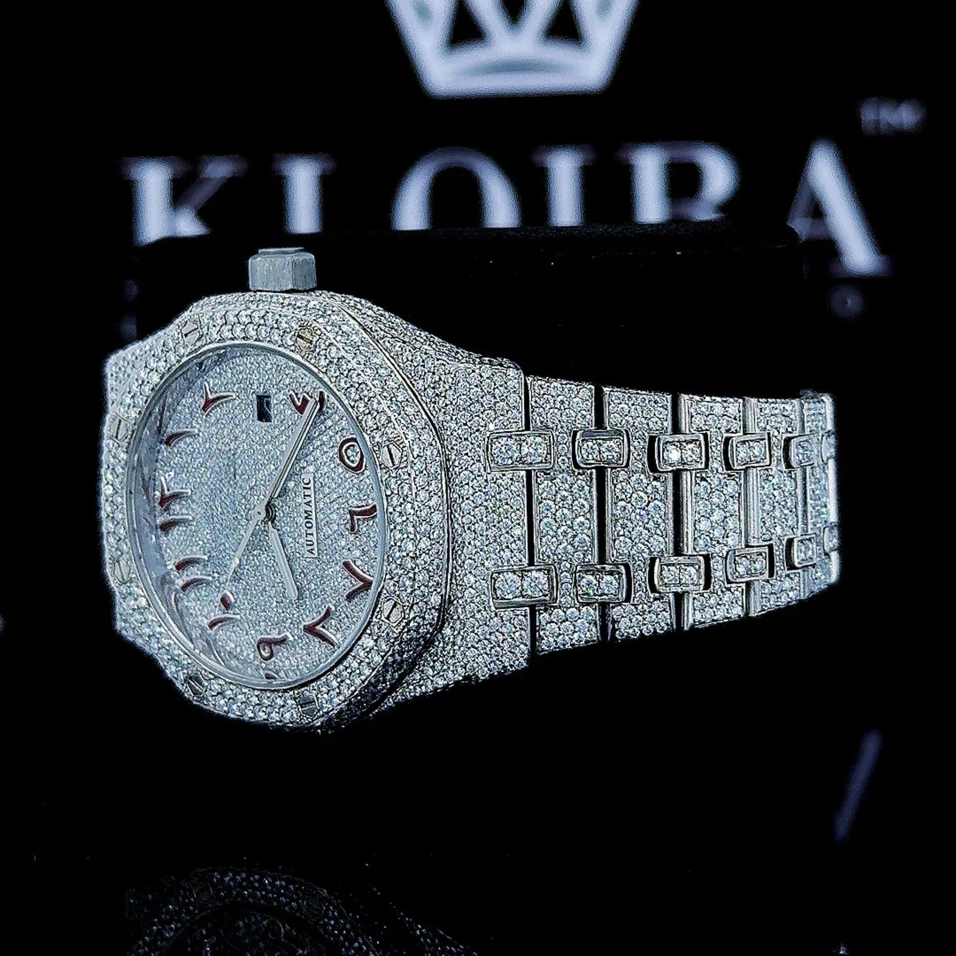 Fully Iced Out Red Arabic Numerals White Dial Moissanite Watch Left Profile View
