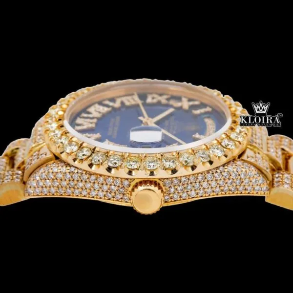 Gold Tone Blue Roman Dial Day Date Display Iced Out Moissanite Watch Crown View