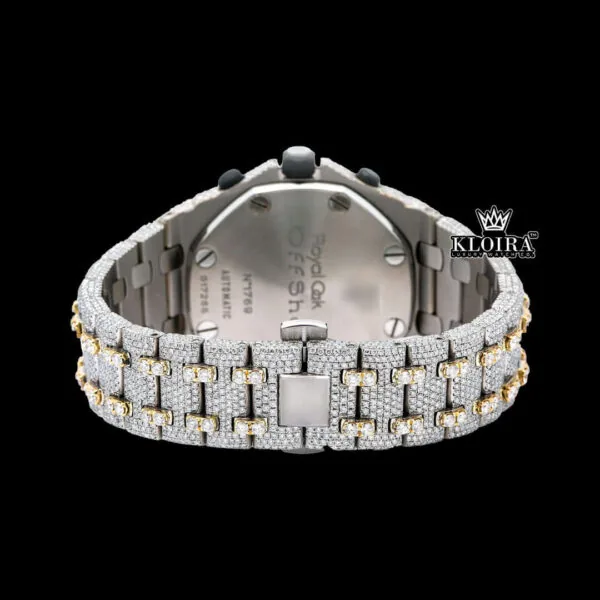 Back view of a luxurious two tone AP diamond watch featuring a silver and yellow gold bracelet.